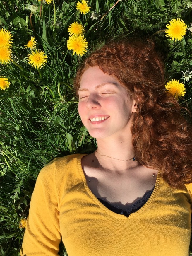picture of Maggie in dandelions